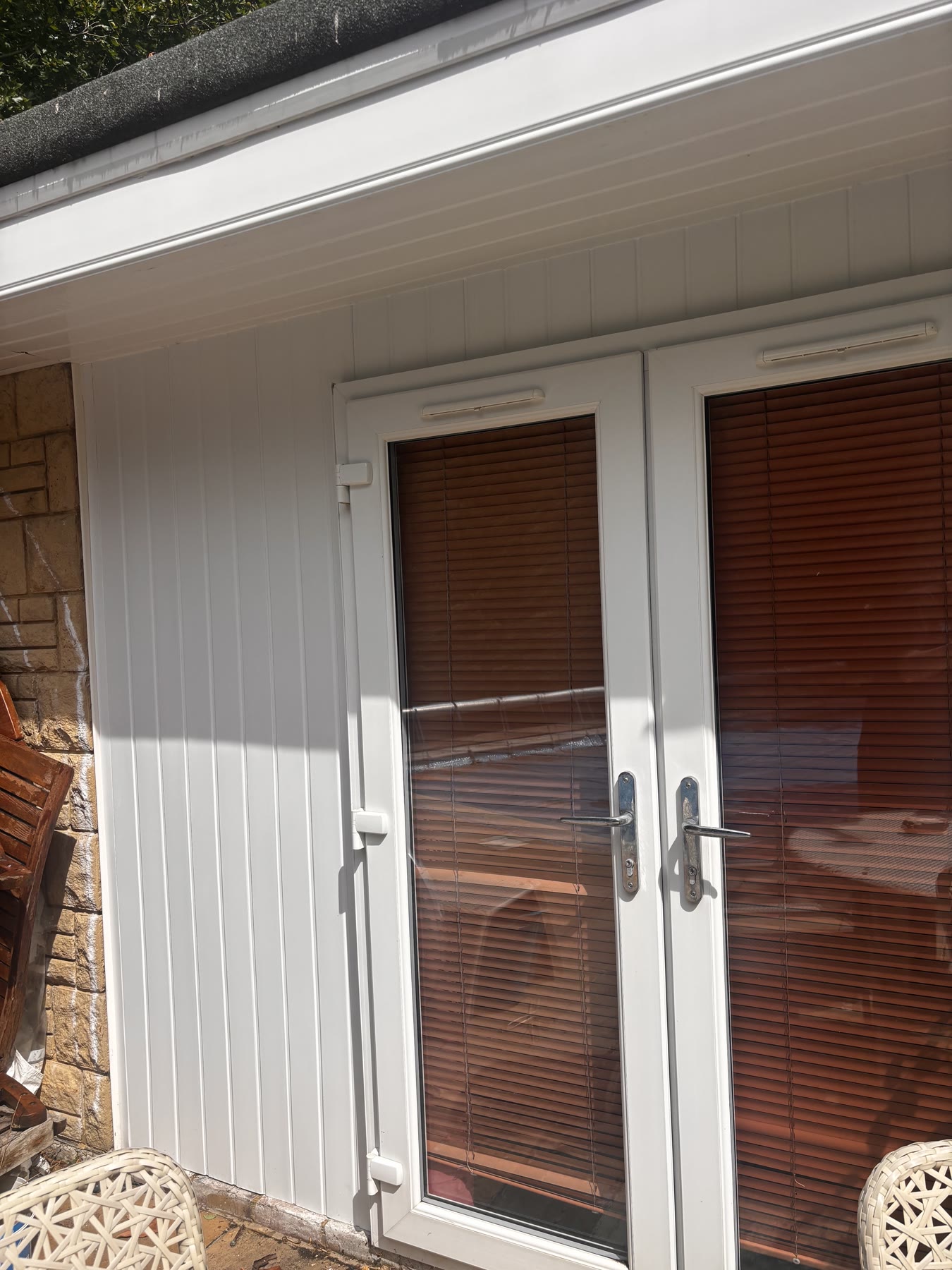White fascia and soffit above patio doors